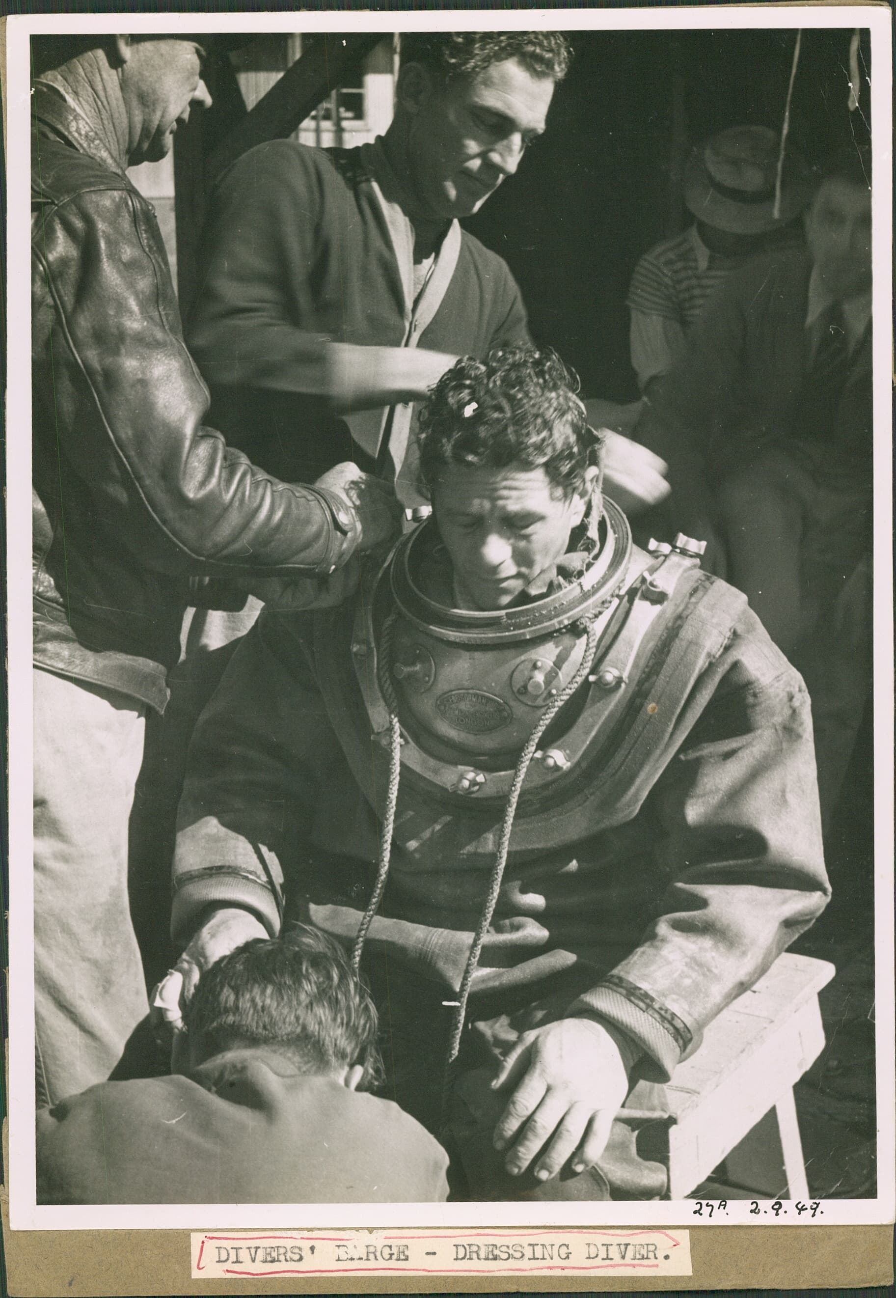 Diver being dressed at Warragamba Dam, 1949